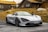 gray sports coupe parking during daytime