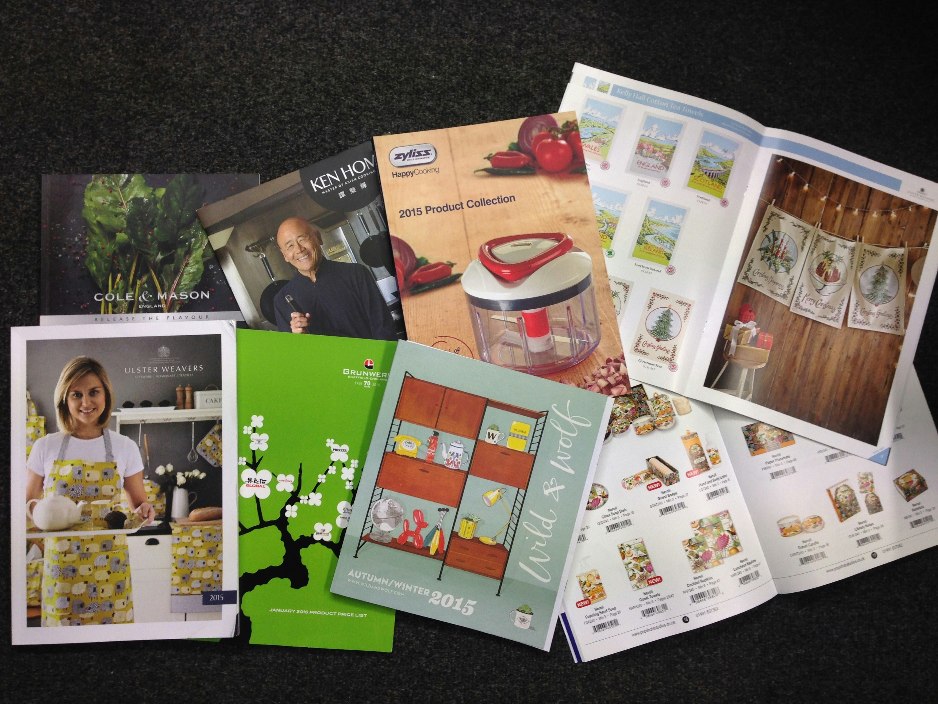 Advertising campaign materials spread including posters, flyers, and promotional items on a light studio surface