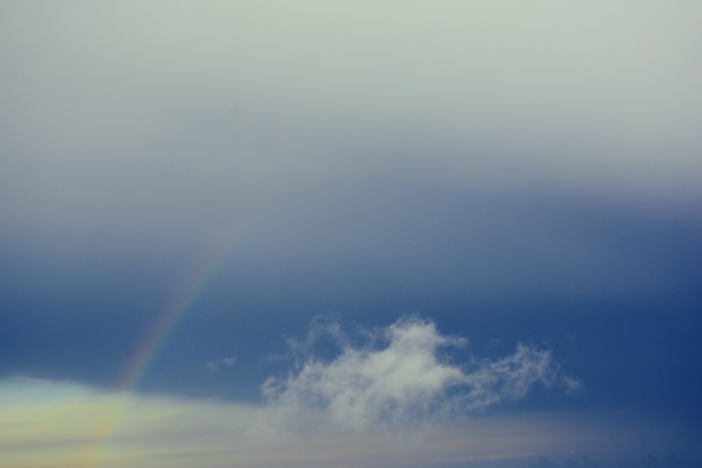 rainbow over clouds nature photography