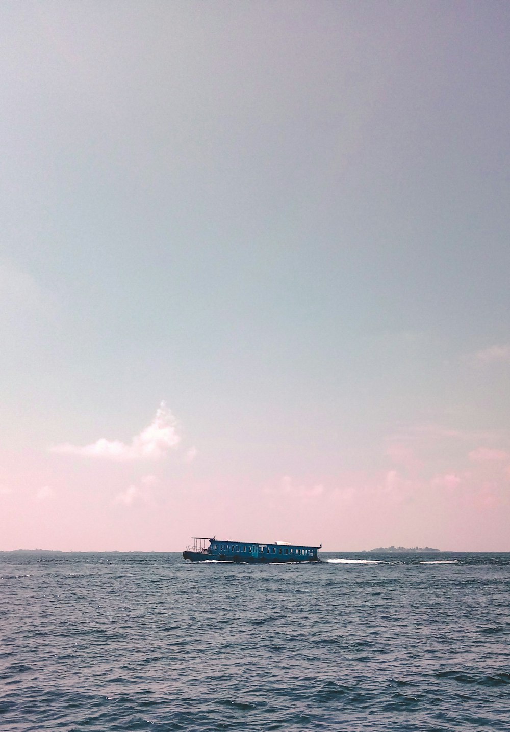 passenger boat on sea during daytime