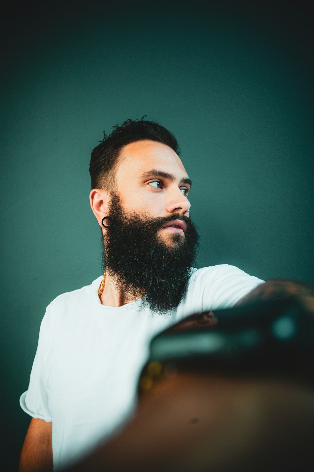 selective focus photography of man wearing white shirt