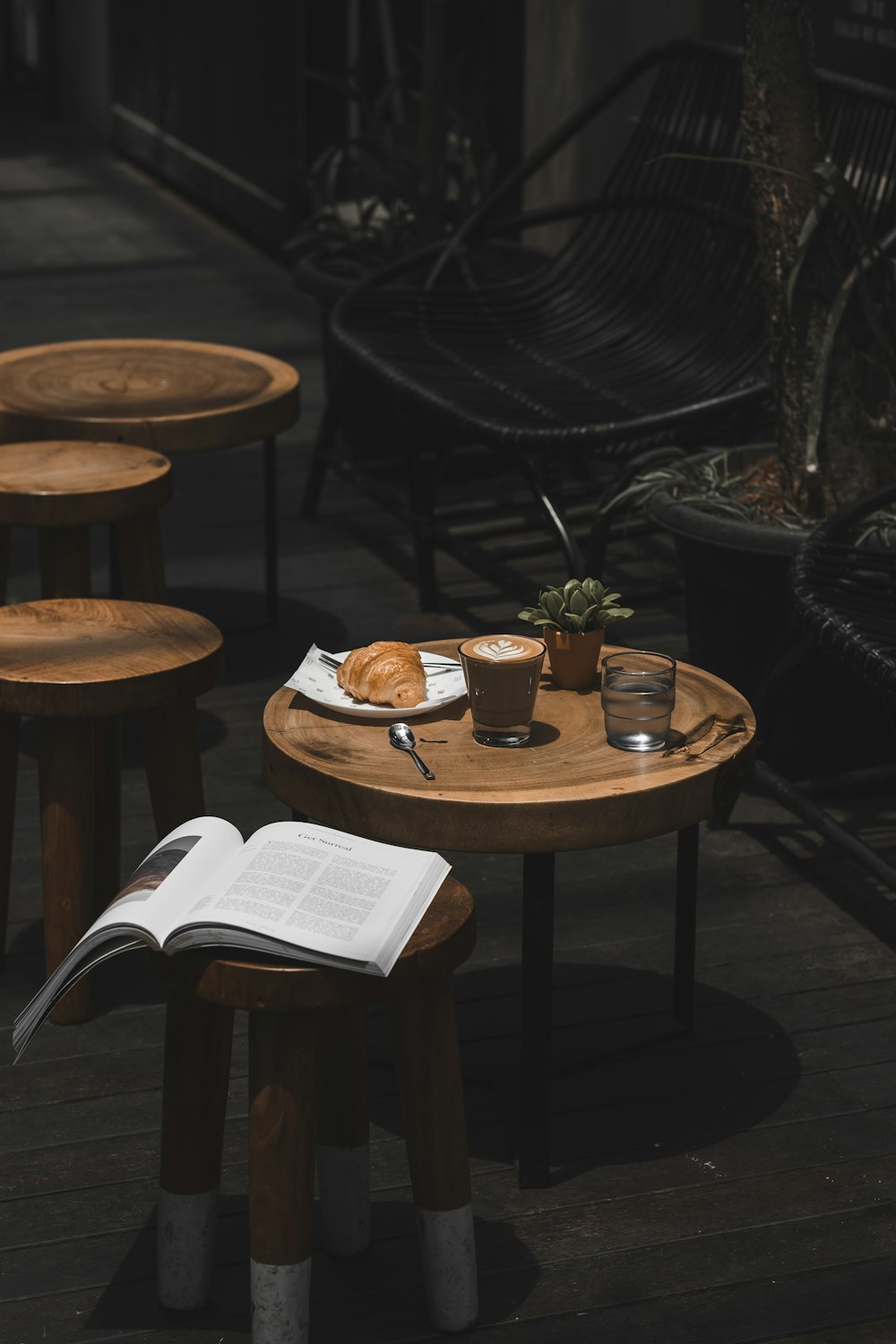 two clear drinking glasses on top of brown wooden table