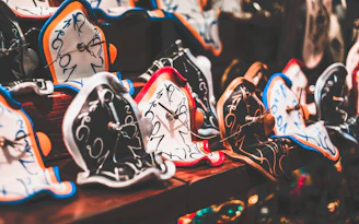 Melted clocks draped over fragmented, floating ruins in a dreamlike landscape.