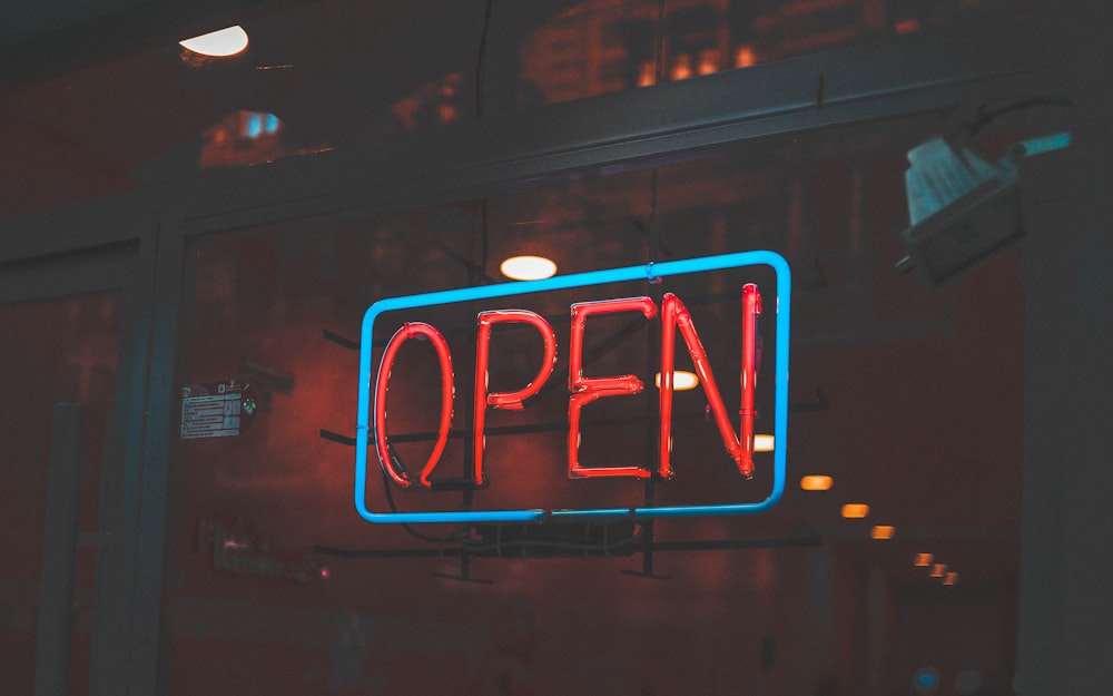 blue and red open neon signage