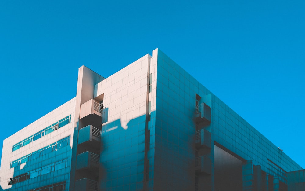 white concrete building under clear blue sky