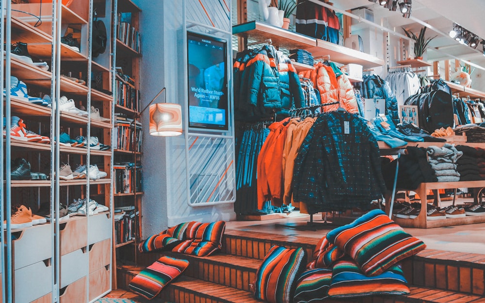 assorted-color striped throw pillows on floor inside room