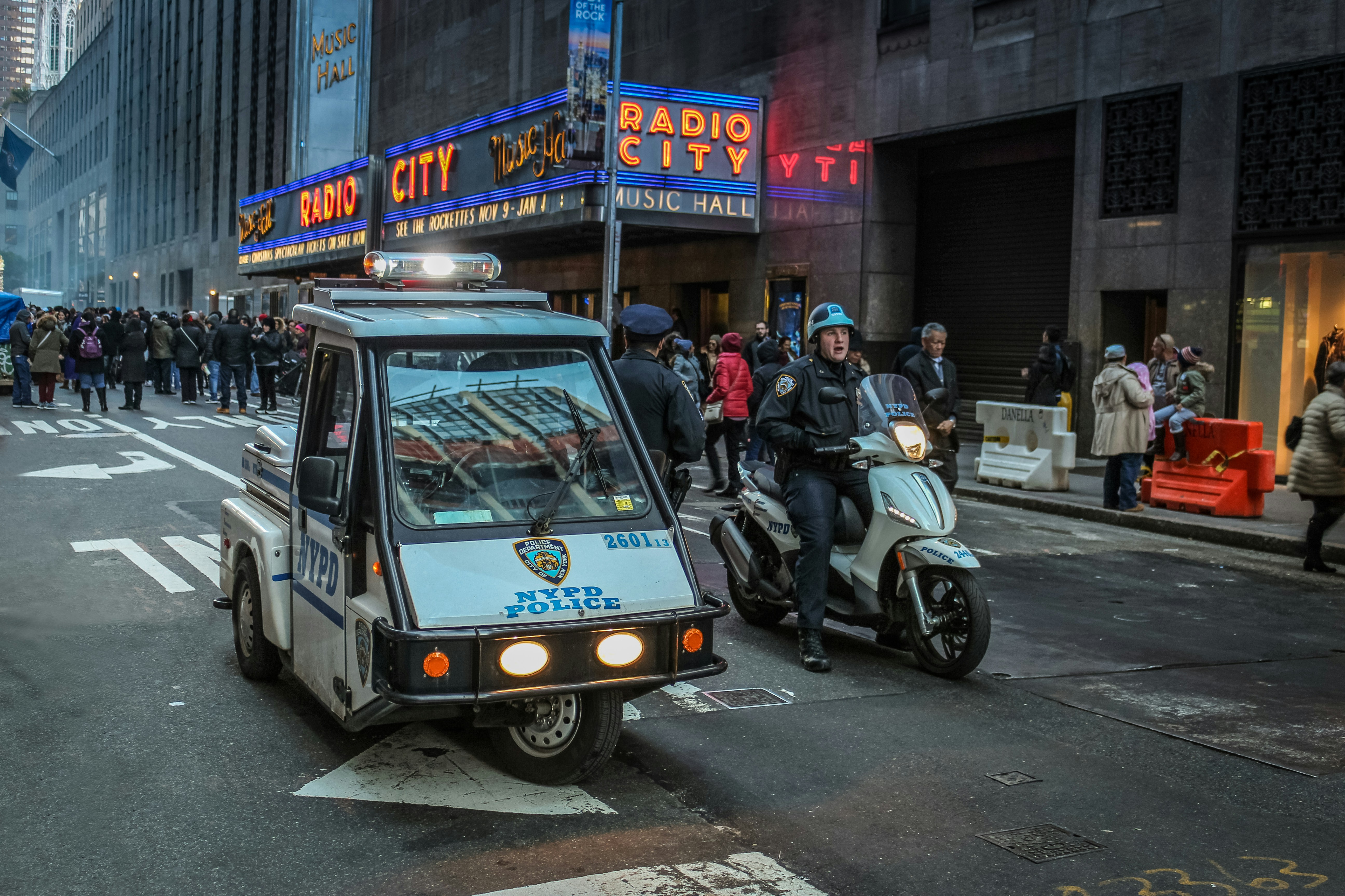 white trike beside motor scooter on road, a fun way to travel with your roommate in NYC