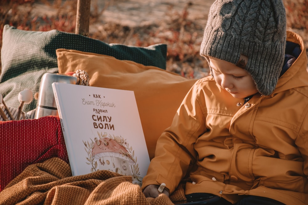 boy wearing yellow coat