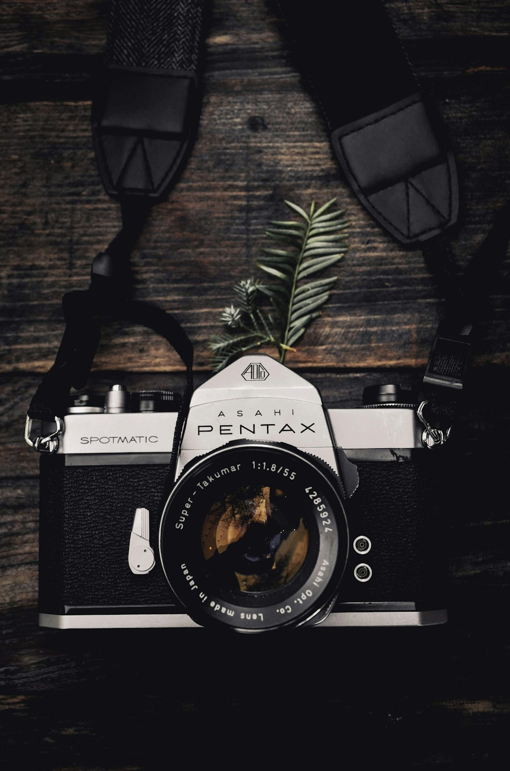black and gray Pentax single-lens reflex camera