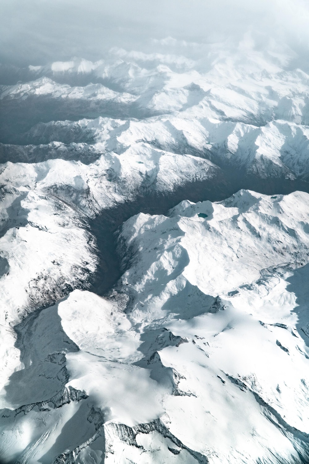 aerial photography of snow covered mountains during daytime