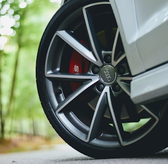 white Audi vehicle with gray wheels