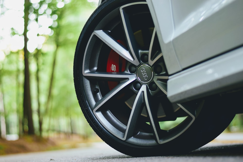 white Audi vehicle with gray wheels