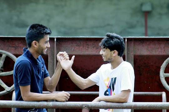 A friendly handshake between two people in a sunny Sebring park.