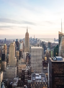 A city skyline at dusk representing global business connections.