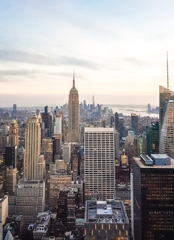 A city skyline at dusk representing global business connections.