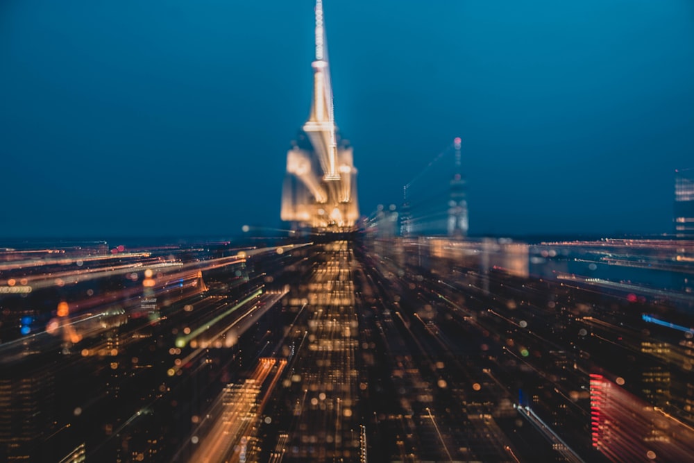 aerial photography of buildings under blue sky at night time