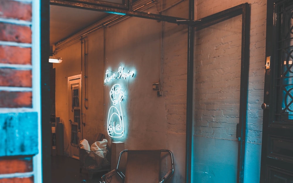 white neon signage with lights on inside room