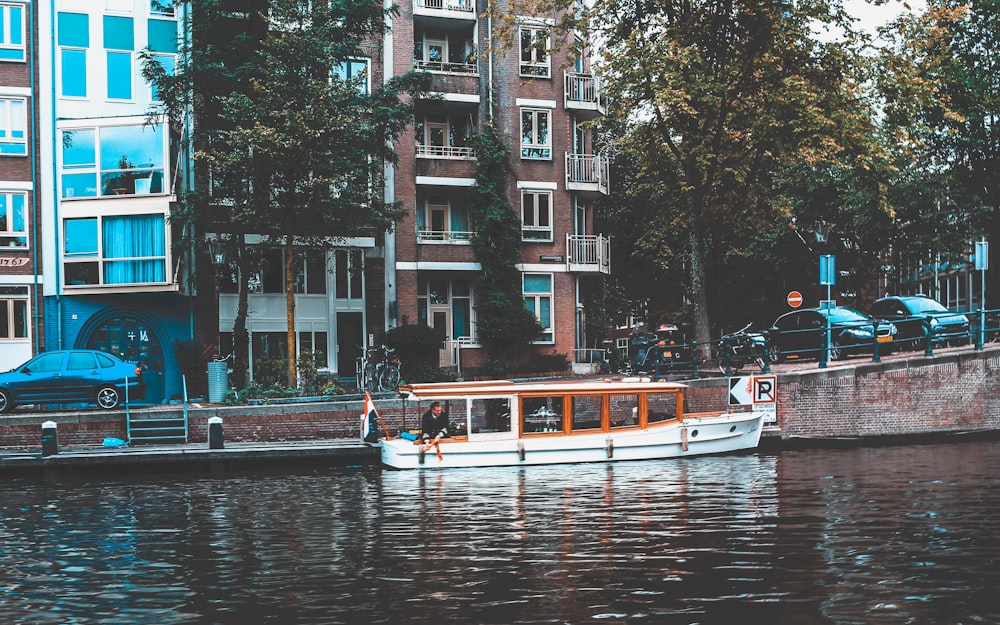 white boat docked near buildings