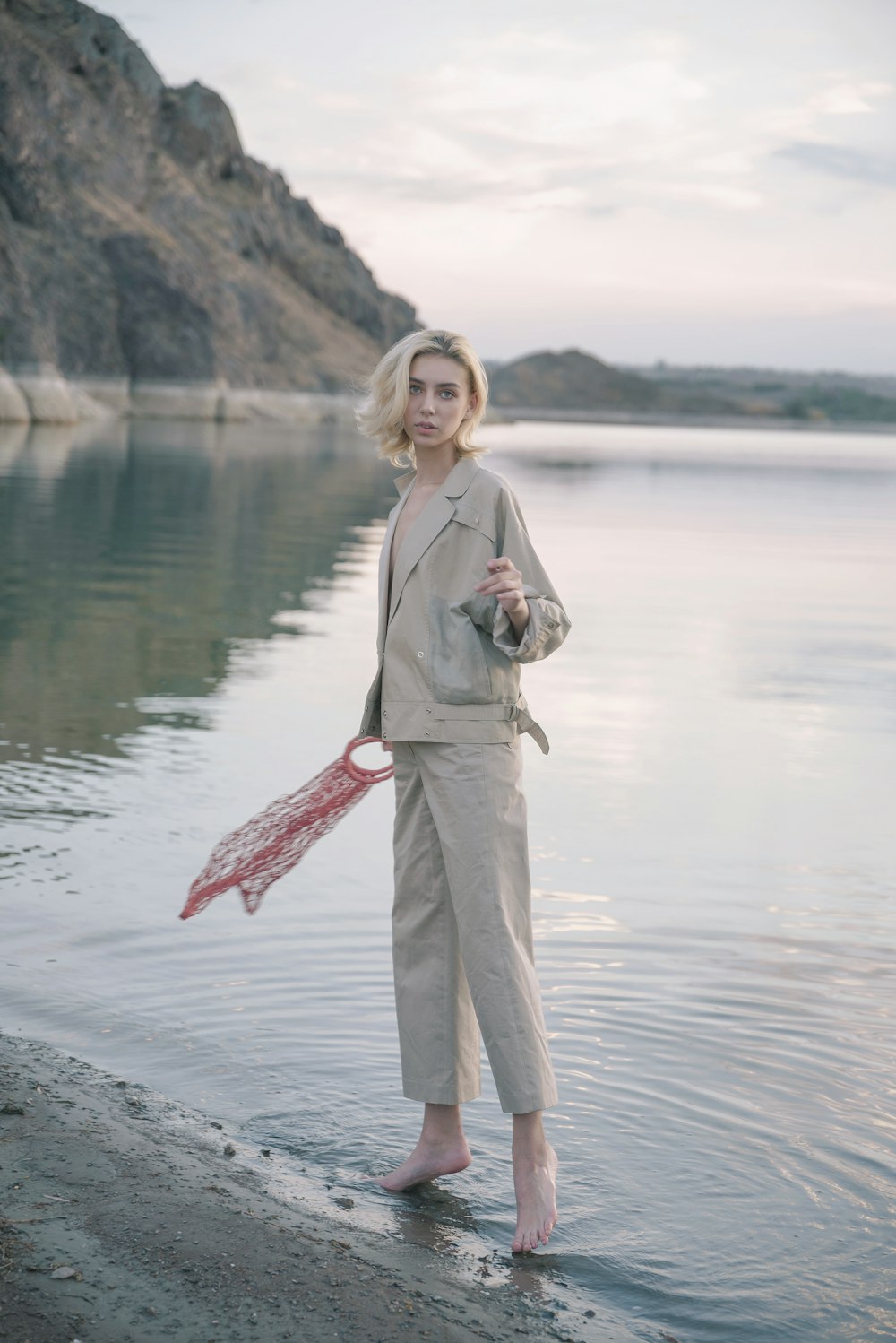 woman standing near body of water