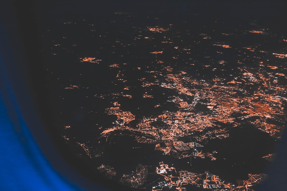 aerial view of city lights over the aircraft window