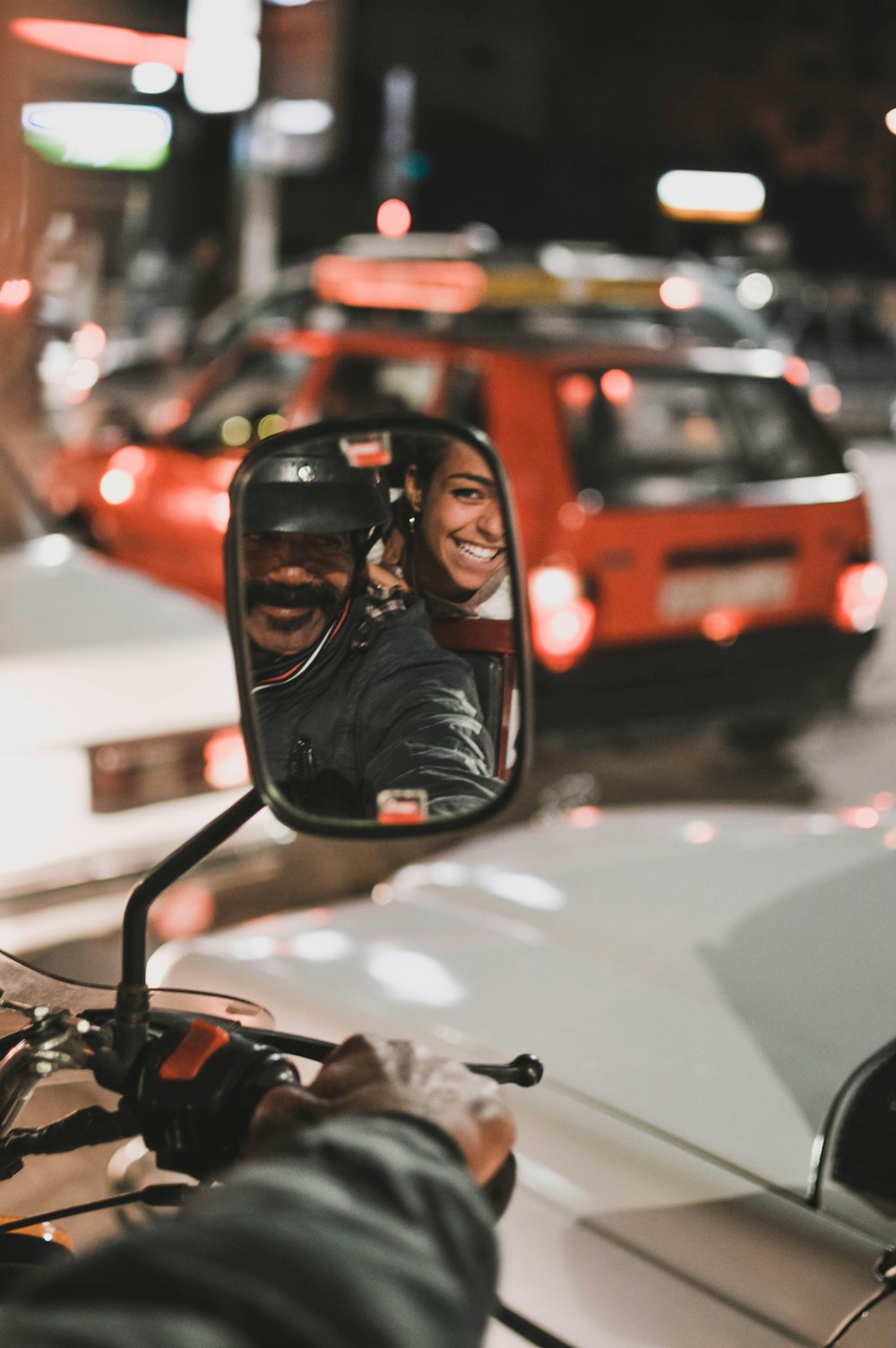 man driving motorcycle at night