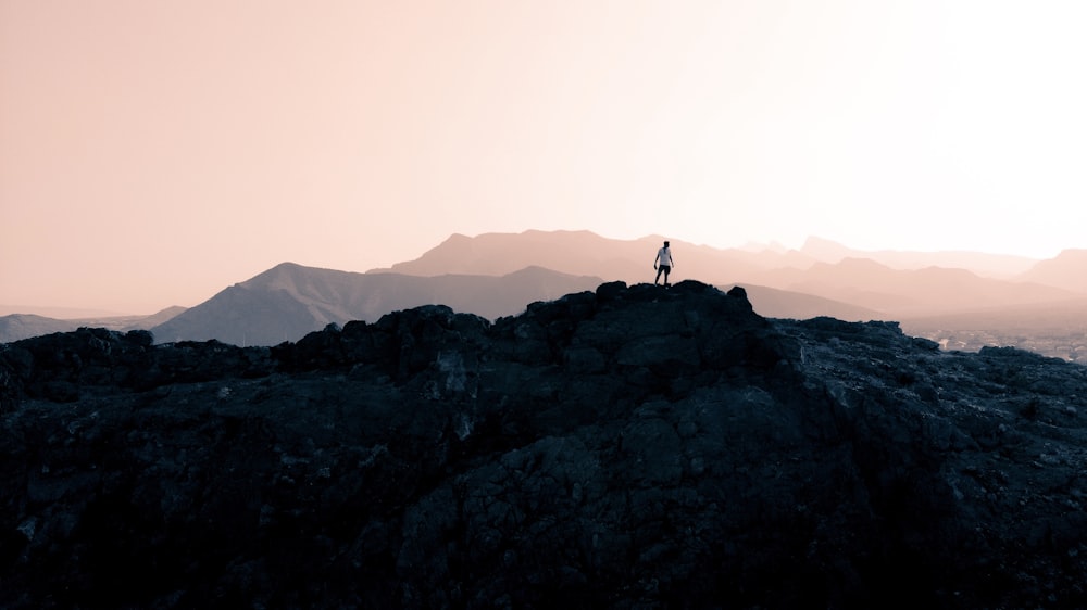 person standing on rock