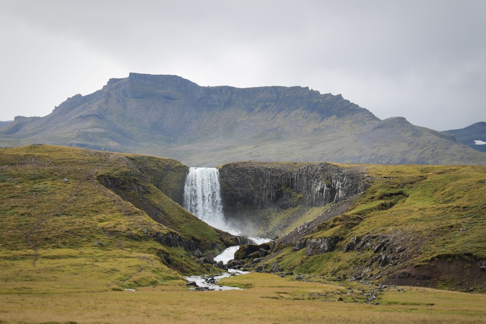 waterfalls in foot of hills