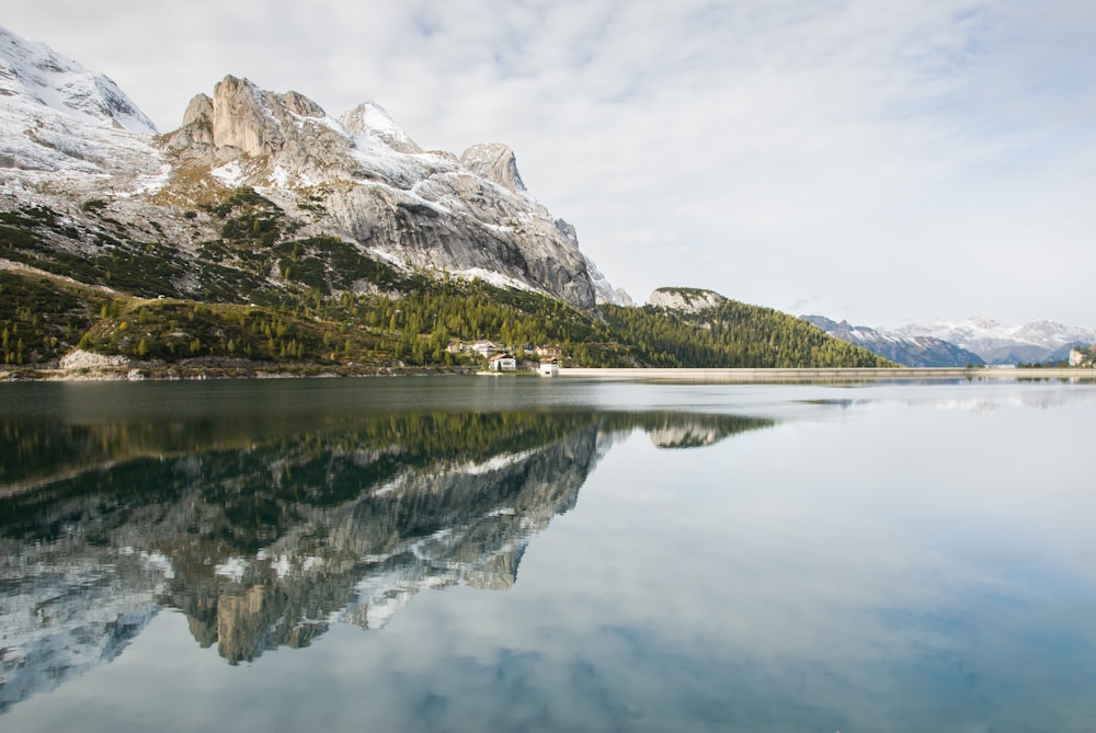 rock mountains near body of water