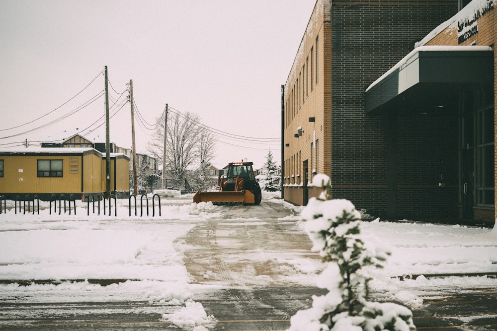 yellow and black heavy equipment vehicle on road