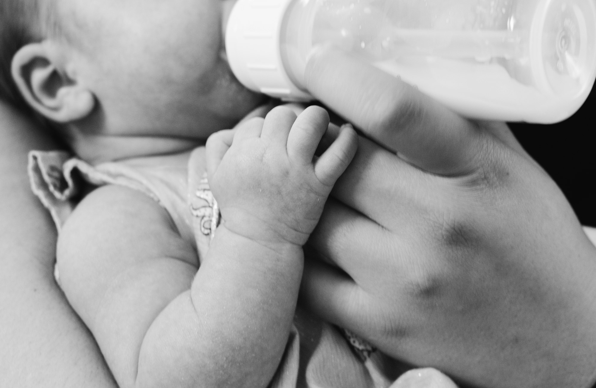 bottle feeding, baby drinking from a bottle, formula fed, expressing breast milk