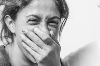Close-up of a comedian on stage delivering a punchline with animated expressions