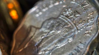 A detailed macro shot showing the intricate design of a silver coin dated 1920.
