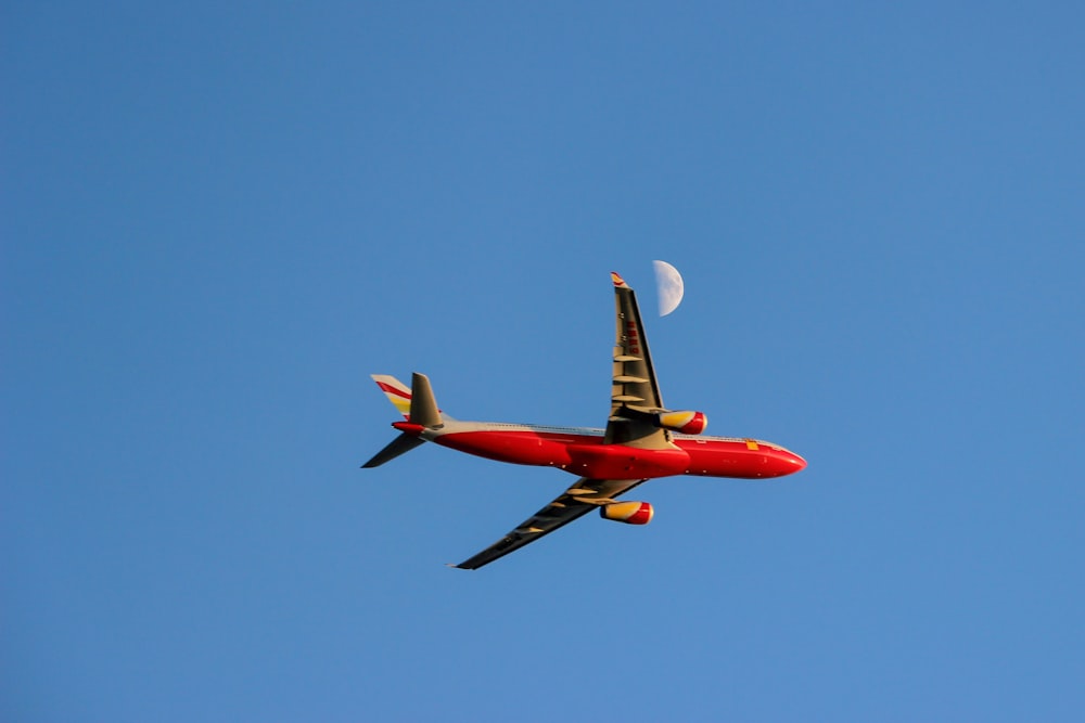 red and beige passenger plane