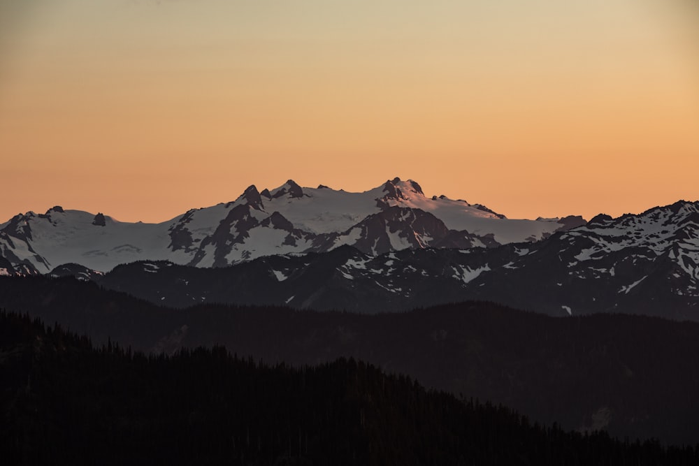 snow capped mountain during golden hour