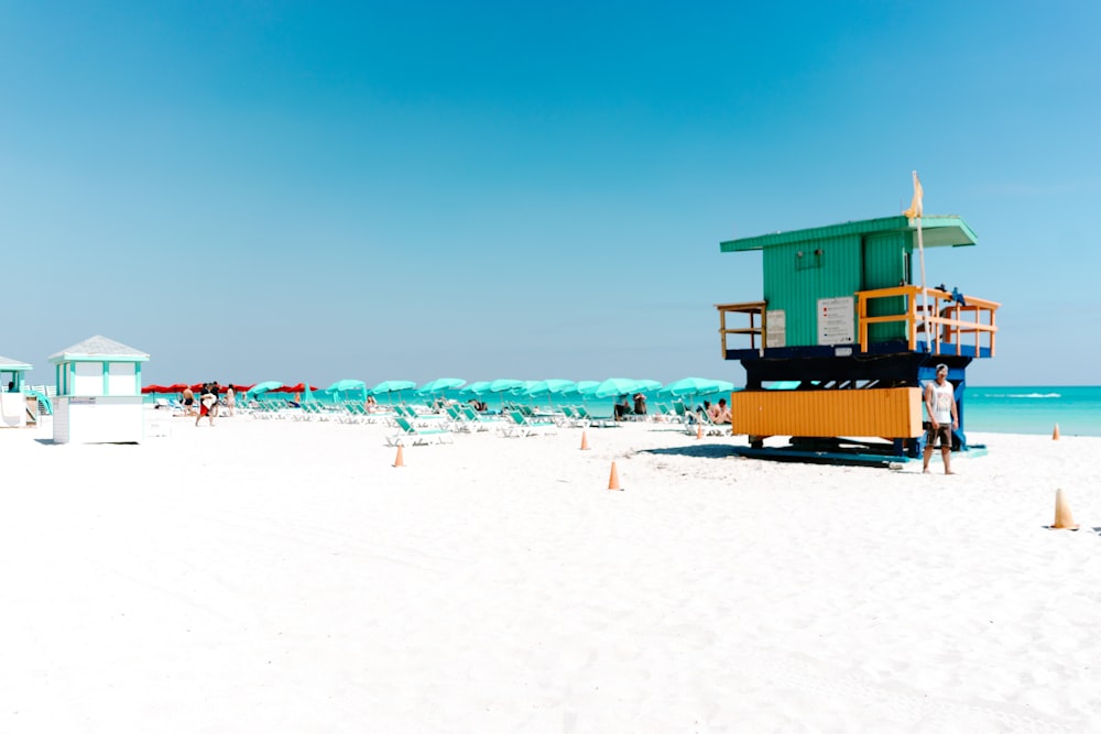 orange and green wooden life guard post