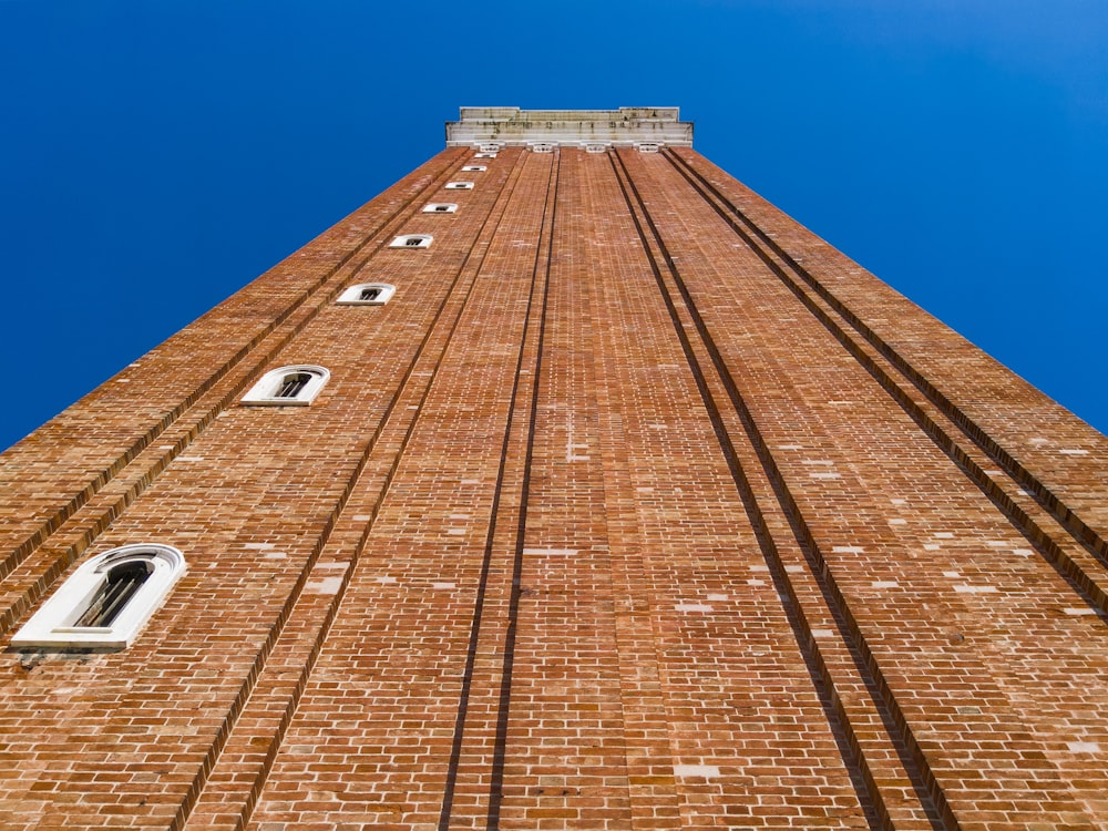 low-angle photography of brown concrete building