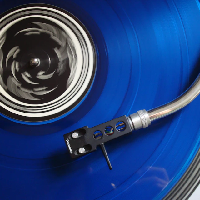 Black and blue turntable seen up close