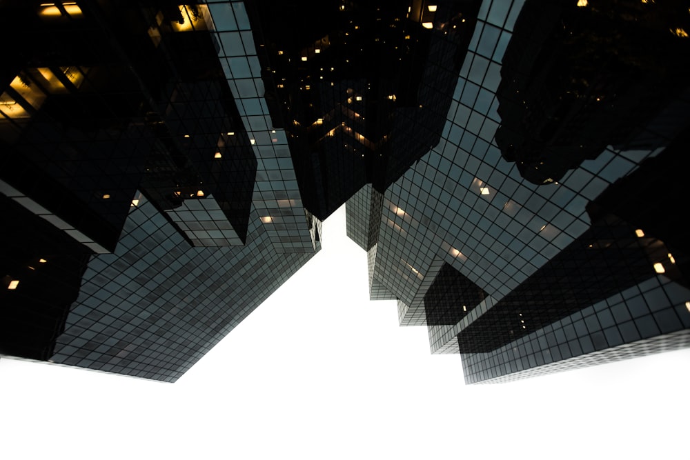 low-angle photography of building during daytime grayscale photography