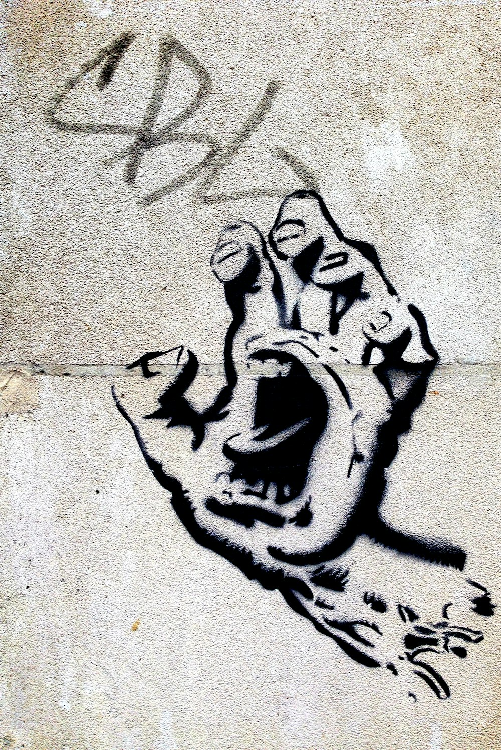 black hand with mouth wall art