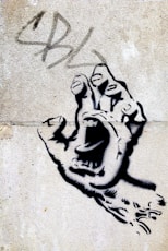 black hand with mouth wall art