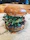 Close-up of a juicy gourmet hamburger with fresh toppings on a rustic wooden table