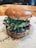 A delicious burger with fresh ingredients on a wooden table.