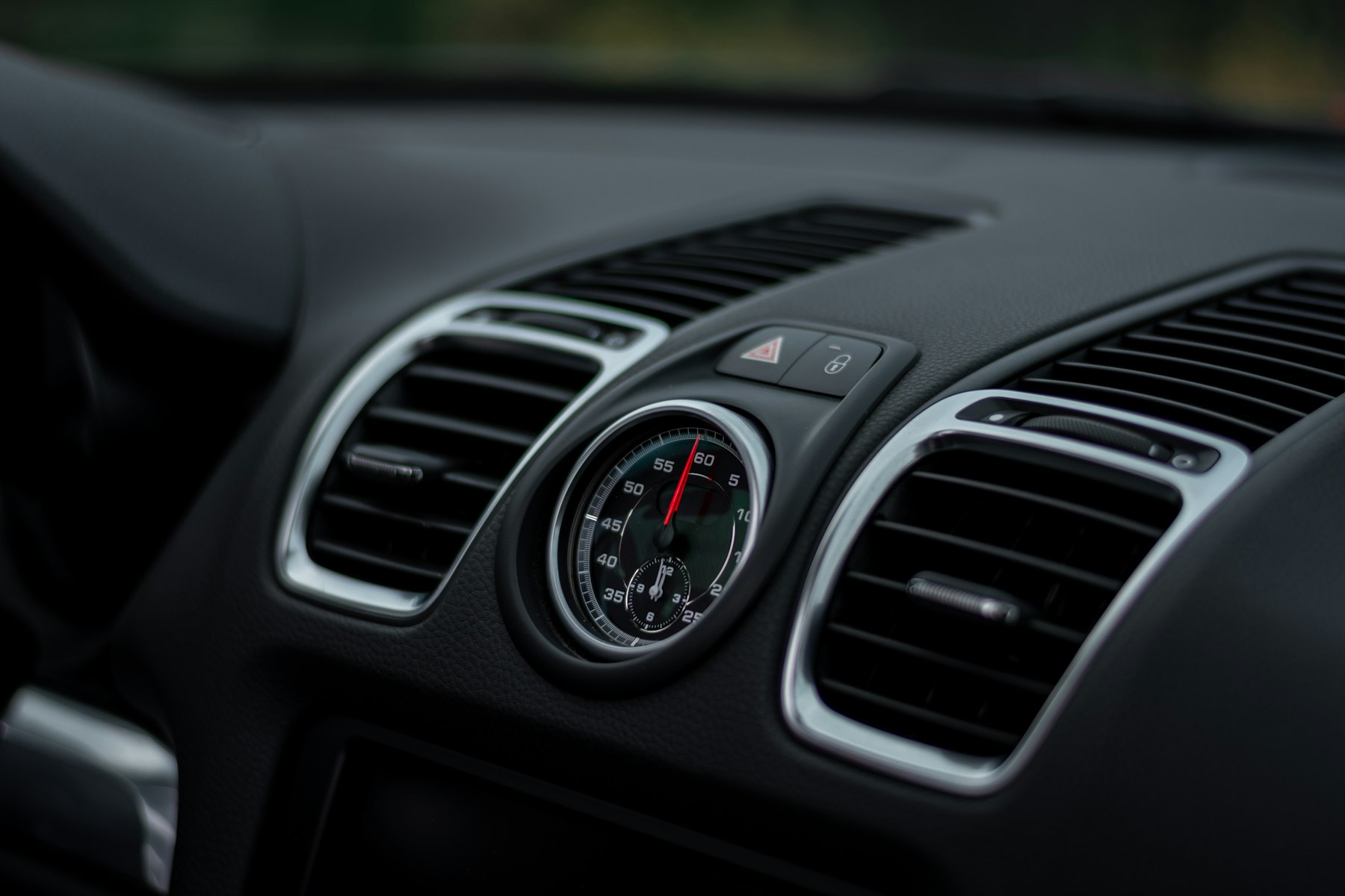 Air conditioning vents on a vehicle dashboard