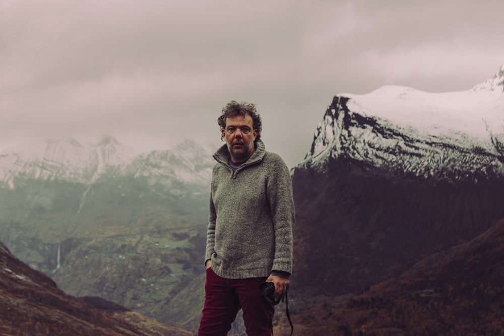 man standing on mountain