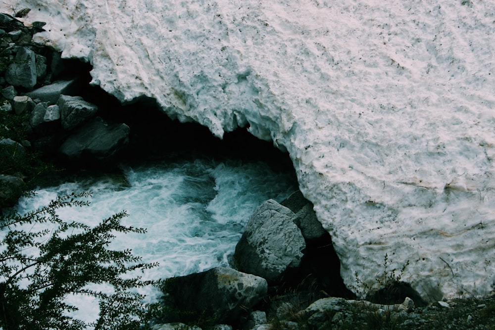 flowing river between gray rocks