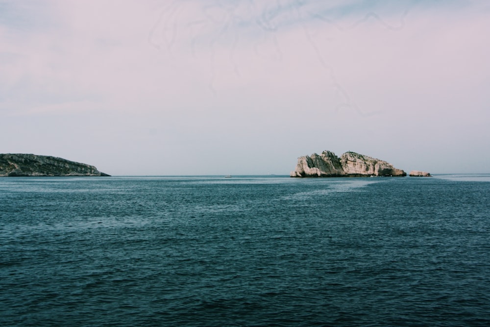 island near the ocean photography