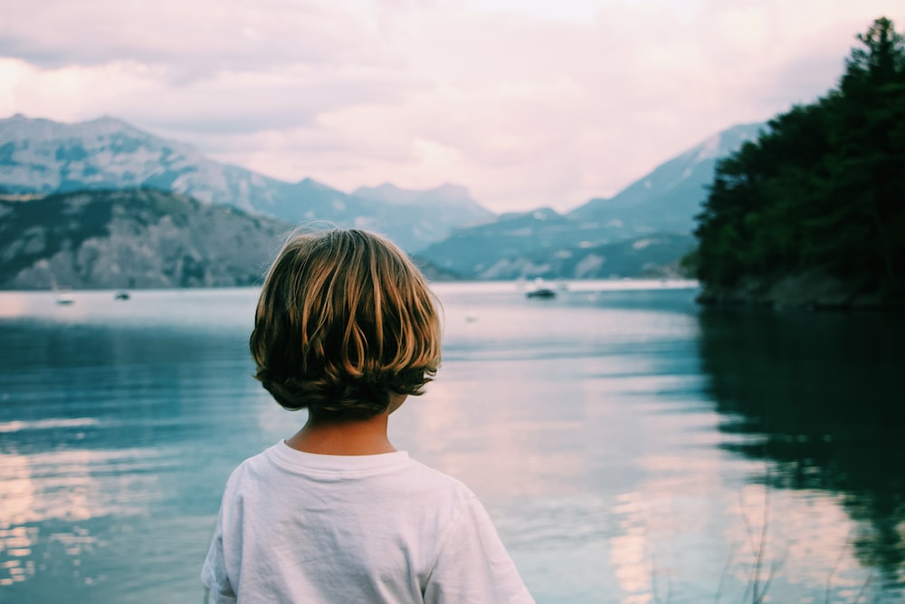 girl standing near the body of water