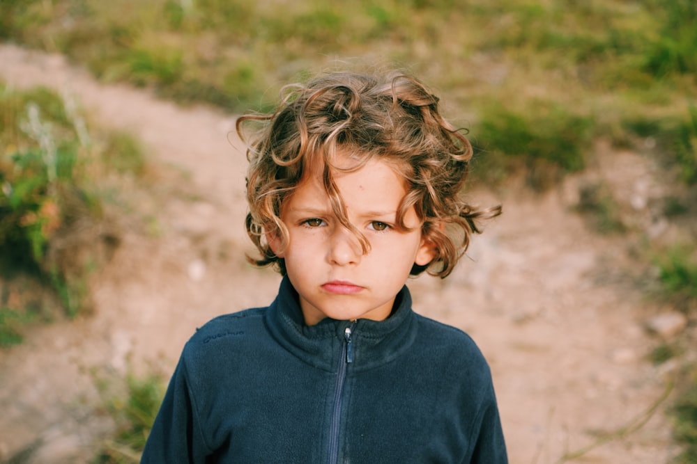 boy wearing zip-up jacket