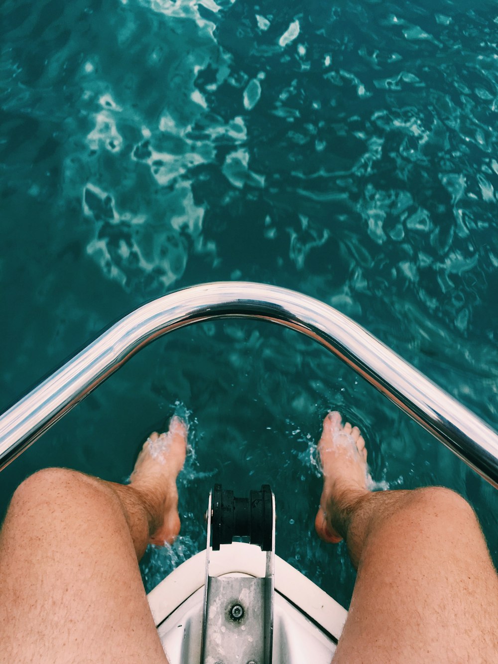 person sitting on power boat