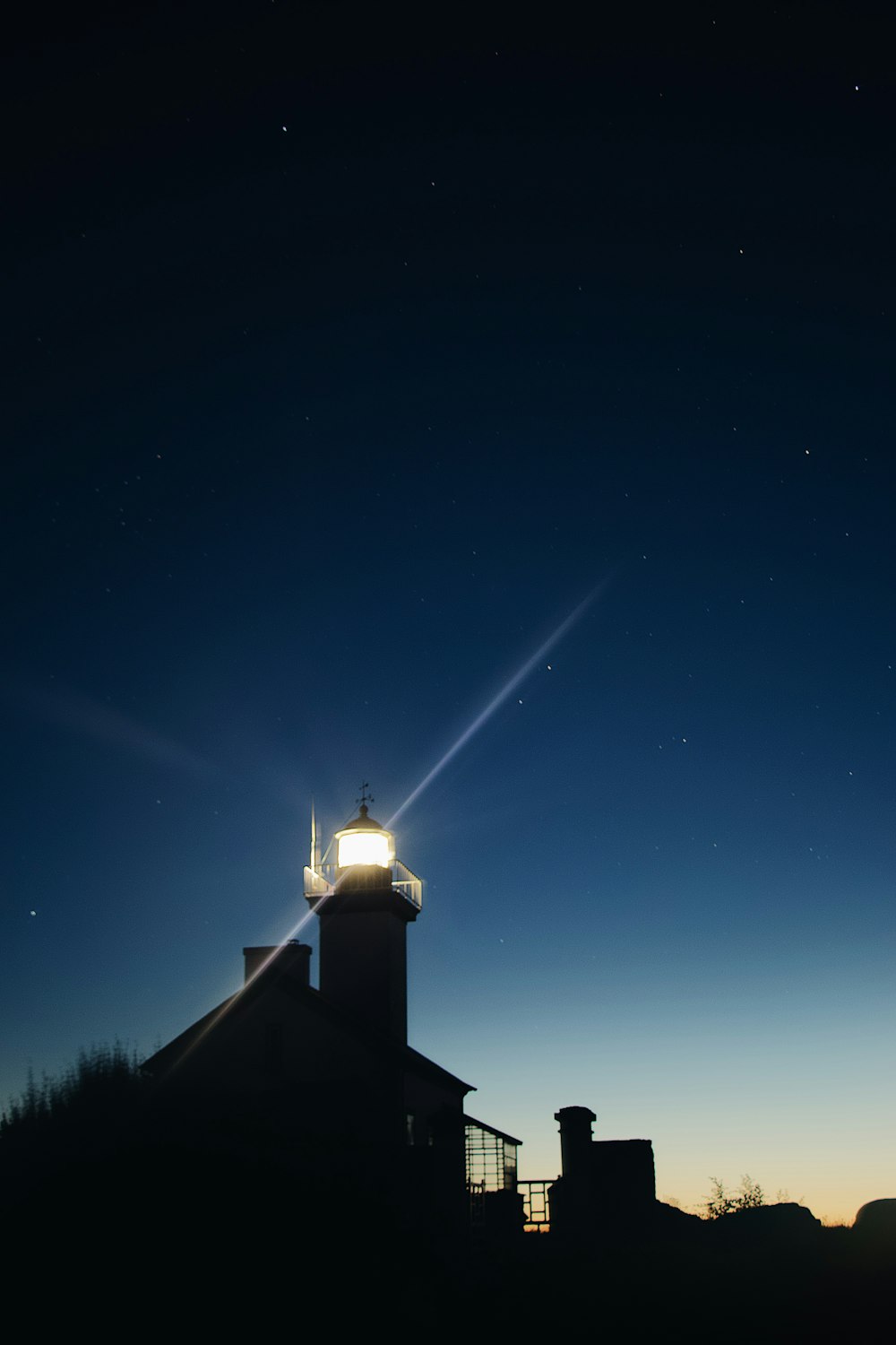 lighthouse shining at night